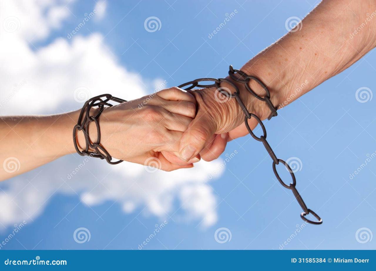 Chained hands together stock